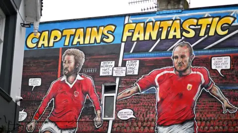 Getty Images A mural on the side of a building showing two Bristol City players