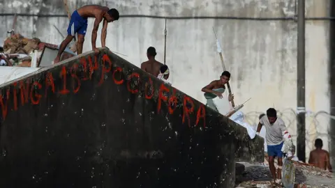 Getty Images Prisoners during a riot at the Alcacuz Penitentiary Center near Natal in Rio Grande do Norte, Brazil on January 17, 2017.