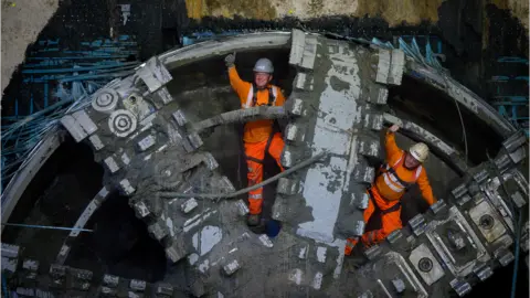 HS2 Ltd HS2 tunnellers operating at tunnel boring machine celebrate breaking through into the Old Oak Common Box