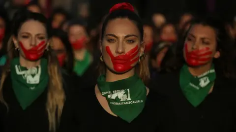 EPA Women take part in a march to mark the International Day for the Elimination of Violence against Women, at Plaza Italia in Santiago, Chile, 25 November 2019.
