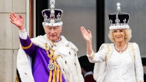 Getty Images King Charles III and Queen Camilla on the balcony of Buckingham Palace, London, following the coronation on May 06, 2023 in London,