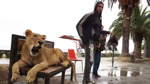 Getty Images A man and his lion, at the Black Sea, Abkhazia