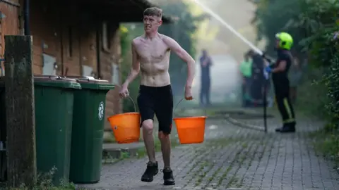 Ian Forsyth Residents help fiirefighters in north yorkshire