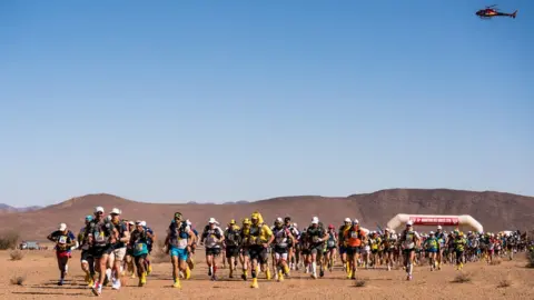 iancorless.com The start of the Marathon des Sables with a helicopter hanging overhead