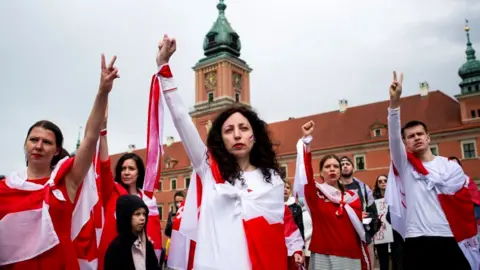 Getty Images A group of Belarusians and Poles gathered in Warsaw Old Town