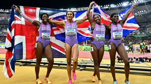 Reuters Britain's Asha Philip, Imani Lansiquot, Bianca Williams and Daryll Neita celebrate after winning the bronze medal in the women's 4x100m final at the World Athletics Championships in August