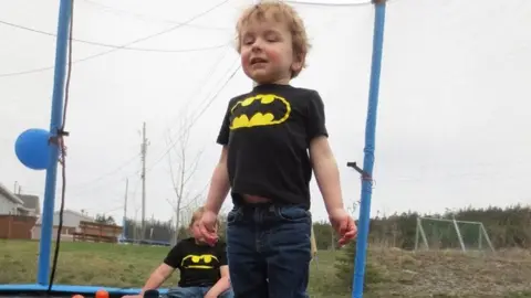 Melissa Slade Jaxson plays in a ball pit