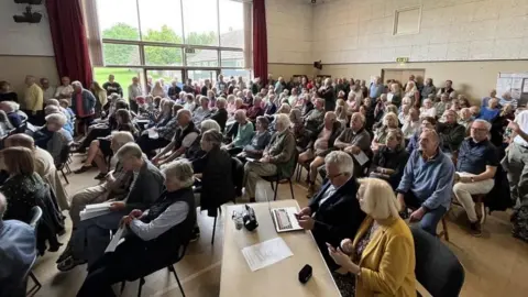 Shaun Whitmore/BBC Meeting about a GP surgery closure in Blakeney