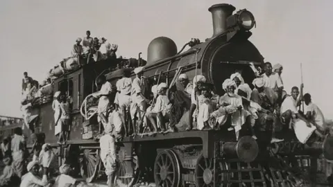 Getty Images Muslim refugees fleeing India for Pakistan crowd train engine, 1947. Gelatin silver photograph shows Muslim refugees fleeing India for Pakistan.