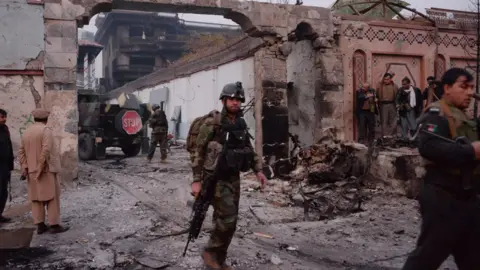 AFP Afghan security officers at the scene of the attack in Jalalabad