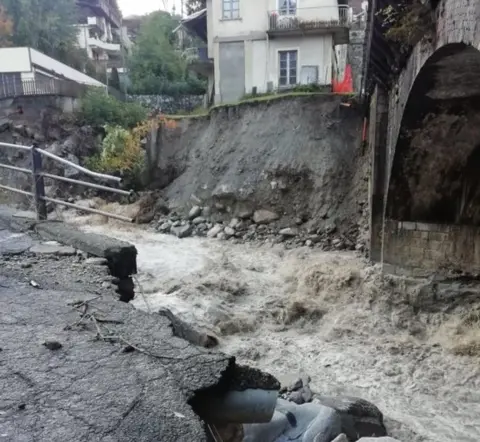 EPA Damaged caused to a road near Cuneo in Italy's Piedmont region