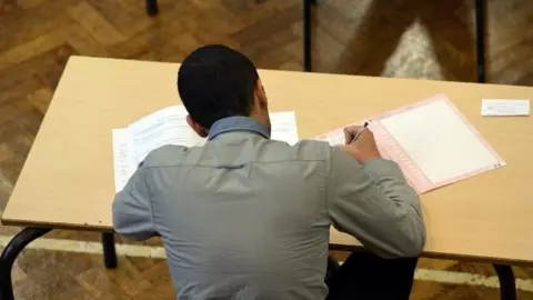 BBC A pupil sits exams. Archive photo