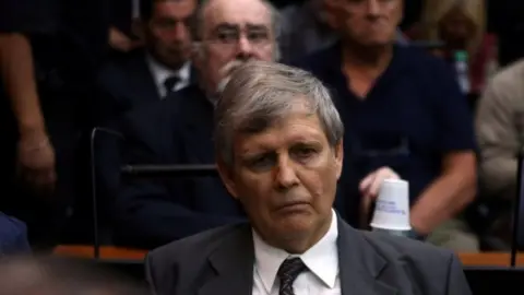 Reuters Former Argentine navy officer Afredo Astiz and other members of Argentina's Naval Mechanics School, known as the ESMA, where the military regime held and tortured thousands of leftists from 1976 to 1983, attend the sentence hearing of the five-year trial for their role during the 1976-1983 dictatorship in Buenos Aires,