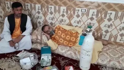 A man is treated with oxygen in Afghanistan