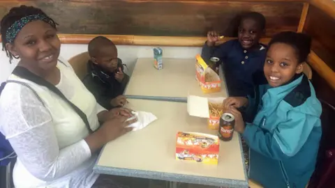 BBC Jackie Mudimi and her children in Chicken Cottage