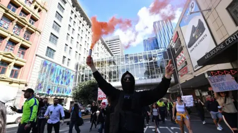 EPA Protesters gather during an anti-lockdown protest in the central business district of Melbourne, Australia, 21 August 2021