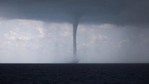 Huge waterspout hits Italy's south-western city - BBC News