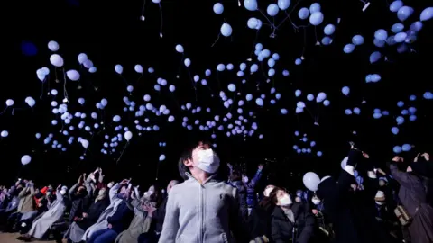 Reuters Revellers release balloons as they take part in New Year celebrations in Tokyo, Japan