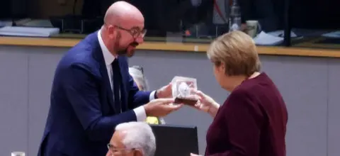 Getty Images EU's Charles Michel and Chancellor Merkel, 22 Oct 21