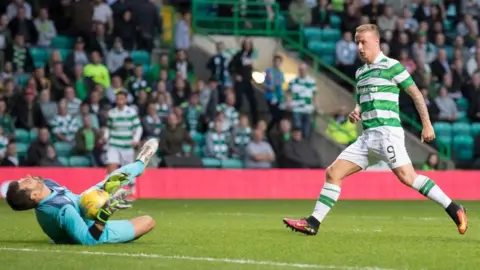 Getty Images Celtic (hoops) in action in the Champions League