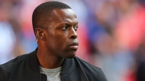 Getty Images Nedum Onuoha looks on during the Sky Bet Championship Play-Off Final match between Huddersfield Town and Nottingham Forest at Wembley Stadium on May 29, 2022