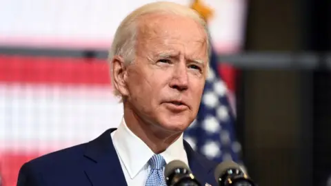 Reuters Joe Biden at microphone