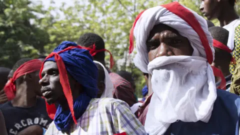 AFP Young Fulanis listen to a declaration during a demonstration in Bamako on March 15, 2018 organized by the Jeunesse Tabital Pulaaku-Mali, the youth chapter of an organization dedicated to preserving the rights of Mali"s Fulani people, who have become victims of retaliatory violence after being accused of attacks against farmers in central Nigeria"s Plateau state.