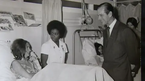 Handout/Birmingham Mail Carol Pearce being visited by the Duke of Edinburgh in hospital