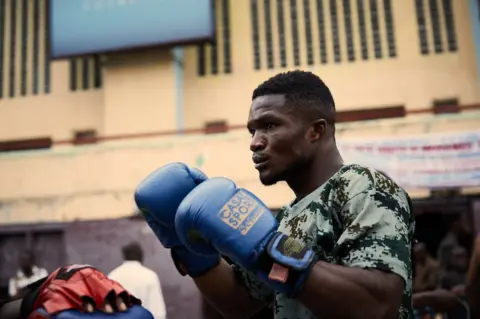 Hugh Kinsella Cunningham Dina Yamé, a boxer at the memorial club