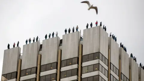 AFP Statues on top of the ITV Television Centre