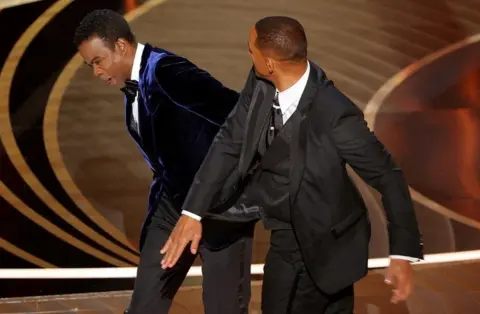 Reuters Will Smith hits Chris Rock at the Oscars