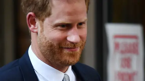 EPA An image showing a close up shot of Prince Harry's face in which he appears to be smiling