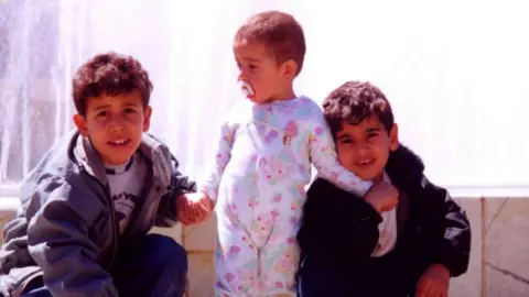 Hamed Amiri Hamed (middle) and his brothers as children