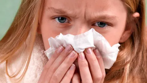 Getty Images Girl with a cold