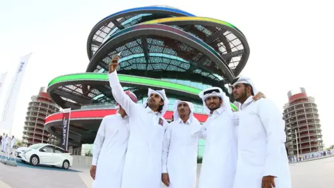 AFP Fans in front of the Khalifa International Stadium in Doha, after it was refurbished ahead of the Qatar 2022 Fifa World Cup