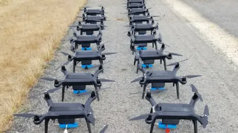 Rajant Many drones on the ground in rows