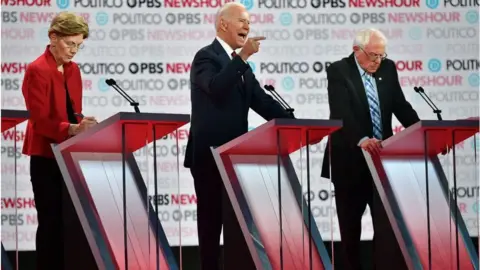 Getty Images Democratic presidential hopefuls Massachusetts Senator Elizabeth Warren (L), former Vice President Joe Biden (C) and Vermont Senator Bernie Sanders (R) participate in the sixth Democratic primary debate