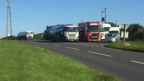 Lorries have pulled up at a nearby lay-by