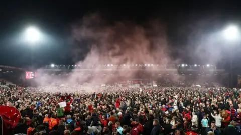 BBC Sport Fans swarm the pitch after Bournemouth beat Nottingham Forest 1-0