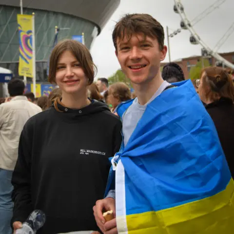 BBC Ukrainian Eurovision fans Liliia (left) and Serhii outside Liverpool's M&S Bank Arena