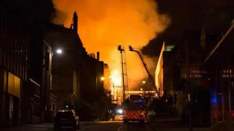 Getty Images Firefighters tackling the blaze