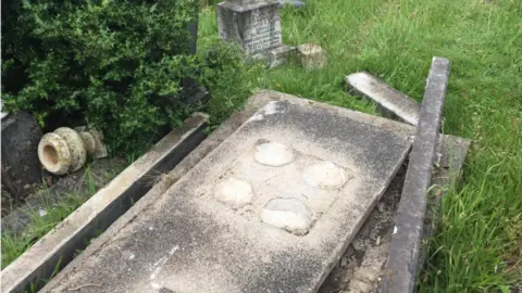 Louise Carpanini the damage to graves at Maesteg cemetery