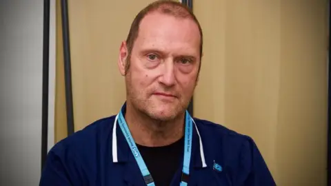 Martin Giles/BBC Andrew Pover