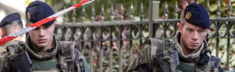 EPA Military officers at the scene of Wednesday's attack