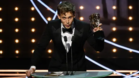 Getty Images Austin Butler accepting the Bafta for best actor