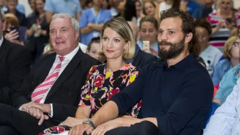 PA Jamie Dornan with his sister Jessica and his father Jim
