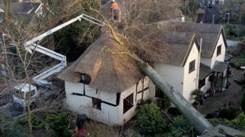 PA Media Damaged house