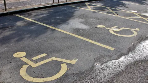 Generic image showing parking spaces for people with disabilities