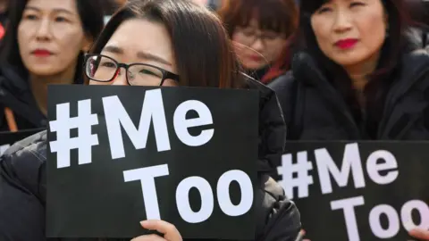 Getty Images South Korean demonstrators hold banners during a rally to mark International Women's Day as part of the country's #MeToo movement in Seoul on March 8, 2018