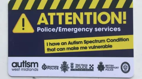 Abby Cappleman A card which reads: 'Attention! Police/Emergency. I have an Autism Spectrum Condition that can make me vulnerable'